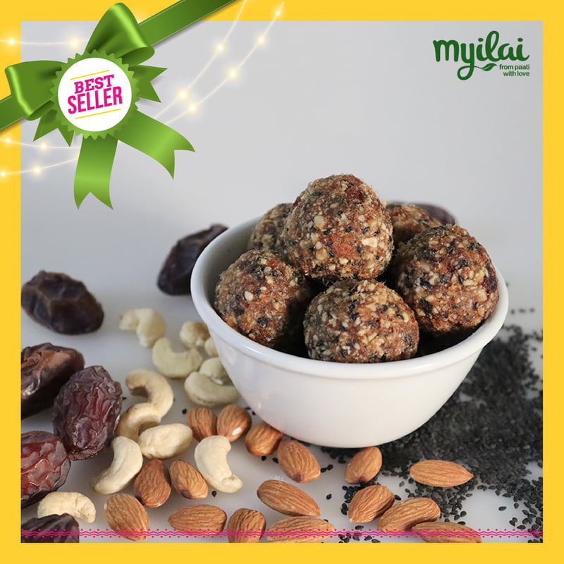 Dates laddu in a bowl with dates and nuts on the table, tagged "Best Seller" from Myilai Sweets.