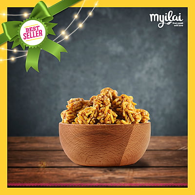 A bowl of Manoharam Sweet Murukku on a table, tagged as best seller with Myilai logo.