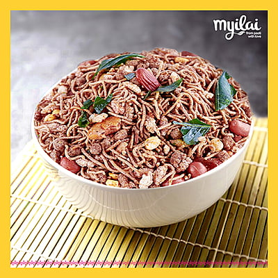 Bowl of RAGI MIXTURE garnished in curry leaves with lyilai logo on top Bowl of RAGI MIXTURE garnished in curry leaves with lyilai logo on top