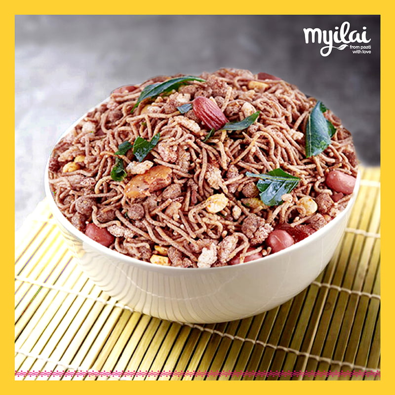 Bowl of RAGI MIXTURE garnished in curry leaves with lyilai logo on top